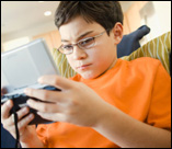 child with handheld game