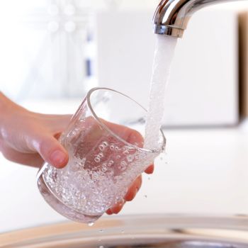 filling a glass of drinking water