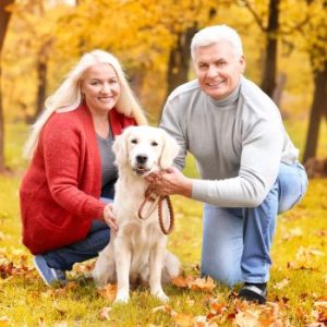 Seniors walking their dog to support brain and eye health